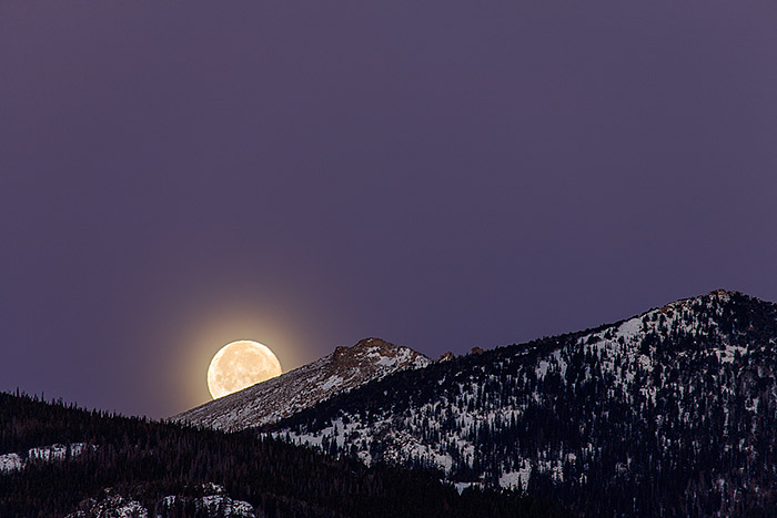 A setting full moon over Beaver Mountain, Rocky Mountain National Park, Colorado 