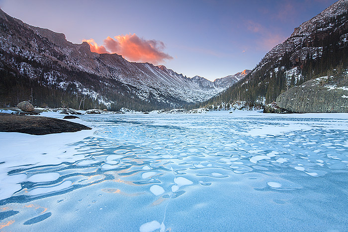 Sunrise over a frozen Mills Lake, RMNP