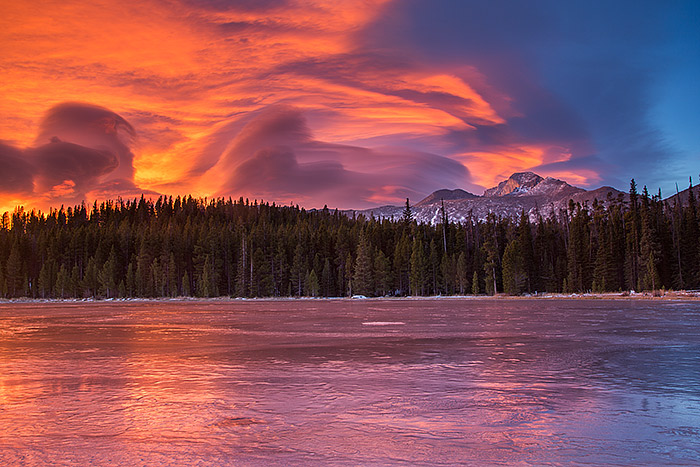 One of the most colorful and dramatic sunrises I've been lucky to experience unfolds over a frozen Bierstadt Lake. Lenticular clouds formed east of Longs Peak and the rising sun lit the underbelly of the clouds in rainbow like fashion. Technical Details: Canon EOS 5D Mark III, 24-105mm F4 IS 