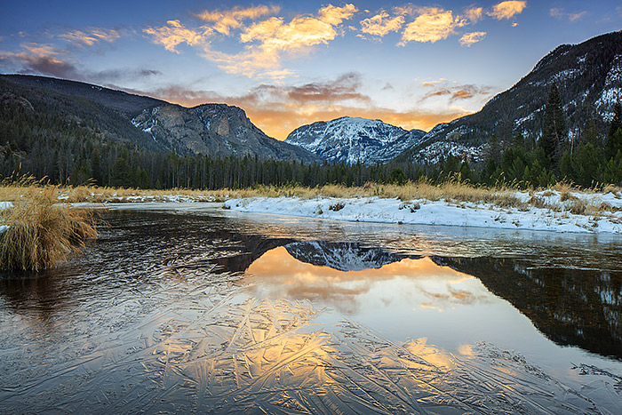 A chilly sunrise unfolds over Mount Baldy and the East Inlet on the west side of Rocky Mountain National Park. Snow covers the meadow and the East Inlet has started to ice over for the winter with only small open areas of water left to reflect the colors of sunrise. Technical Details: Canon EOS 5D Mark III, 24mm TS-E F2.3 L II