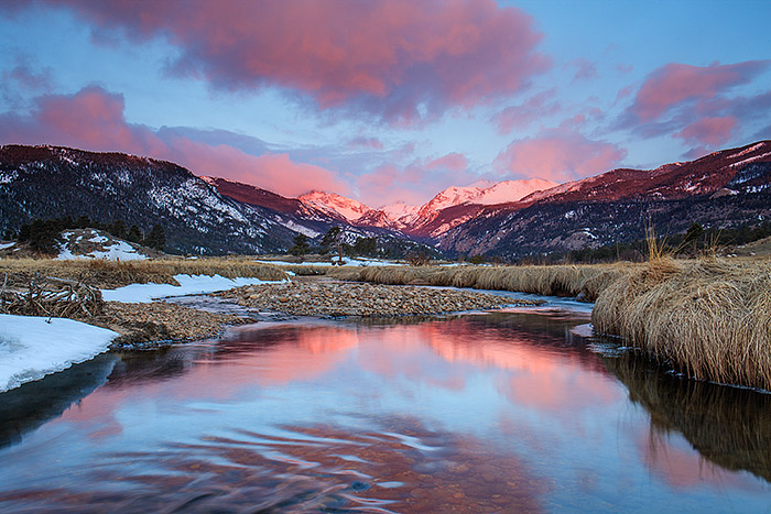 Colorful skies rise above Moraine Park on a spring morning in Rocky Mountain National Park. The Big Thompson River has finally begun to thaw out allowing for images of moving water and reflections after a long winter freeze. Technical Details: Canon EOS 1Ds III, 24-70mm F4 IS L 