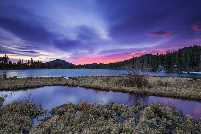 A muted but still beautiful sunrise takes hold over Rocky Mountain National Park and Sprague Lake. Conditions in Rocky Mountain National Park are quickly transitioning to late spring conditions with many of the lakes at lower elevations thawed or nearly thawed. Technical Details: Canon EOS 5D Mark III, 17mm TS-E F4