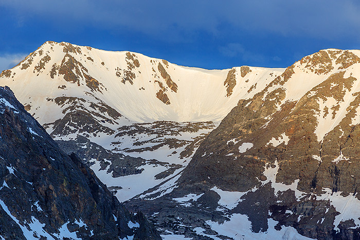 Looking across rugged Forest Canyon, drop under light illuminates the still heavy snowpack on Mount Ida. The opening of Trail Ridge Road in Rocky Mountain National Park is a welcome event which allows more options for photographers to chase the light in Rocky. Technical Details: Canon EOS 5D Mark III, 70-300mm F4-5.6 L  IS
