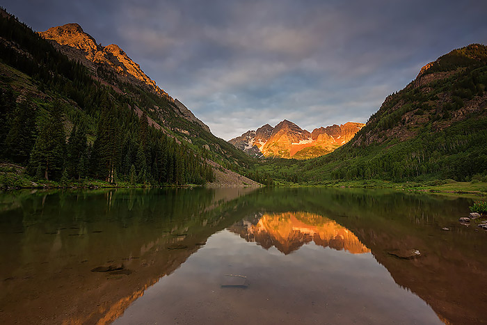 Drop under light illuminates North and South Maroon Peak from Maroon Lake. I've spent many mornings along the shores of Maroon Lake but I've never been lucky enough to be here to witness a sunrise like the one this particular morning.Technical Details: Canon EOS 5D Mark III, 16-35mm F4 IS L 