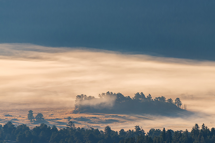 With the recent addition of a Sigma150-600mm 5-6.3 DG HSM OS C to my lens kit, I've been putting it's longer focal lengths to good use when photographing landscapes in Rocky Mountain National Park. I purchased the lens to use primarily for wildlife in Rocky but have found the longer focal lengths to be very useful at compressing and isolating portions of the landscape. I found this to be the case when photographing low lying fog in Moraine Park from the Many Parks Curve overlook along Trail Ridge Road. Using the 600mm focal length on the lens, I was able to isolate this portion of Moraine Park as the fog moved out. Technical Details: Nikon D810, Sigma150-600mm 5-6.3 DG HSM OS C lens