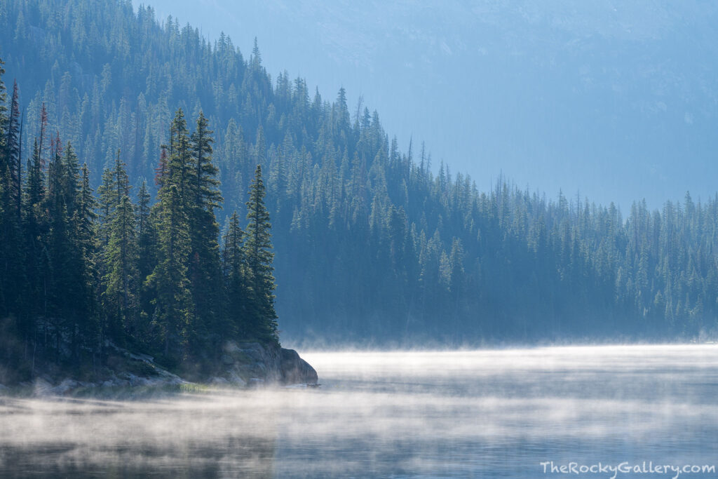 After a stormy afternoon and night, my first morning in the Upper East Inlet broke clear. Low fog however clung to the shore and surface of Lake Verna allowing for this image looking west across the backlit lake. Technical Details: Nikon Z7II, Nikkor 100-400mm F4-5.6 S lens
