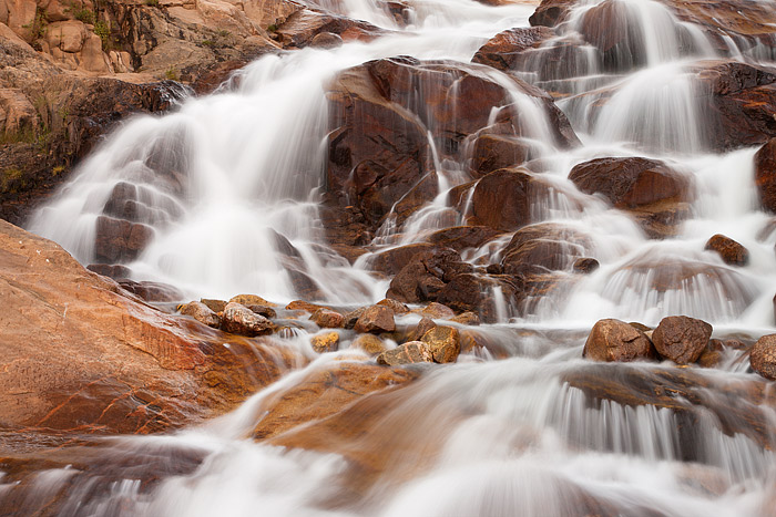 The Roaring River tumbles down a jumble of rocks at the Alluvial Fan Falls in Horseshoe Park. Alluvial Fan Falls is an impressive...