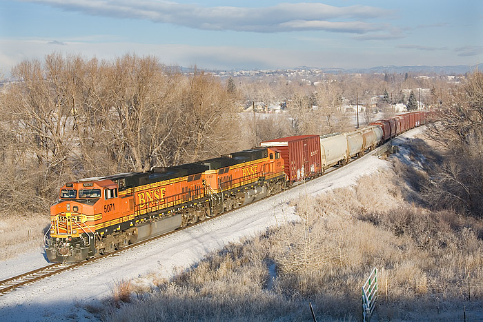 BNSF 5071 leads the Laurel, MT to Denver, CO manifest train southbound at Louisville, Colorado. A light dusting of snow has coated...