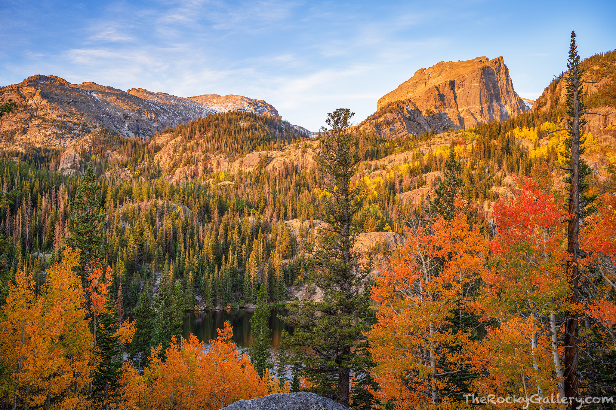 Bear-ly Orange A cool autumn morning at Bear Lake welcomes a warm sunrise to the face of Hallett Peak and Otis Peak above the changing aspen...