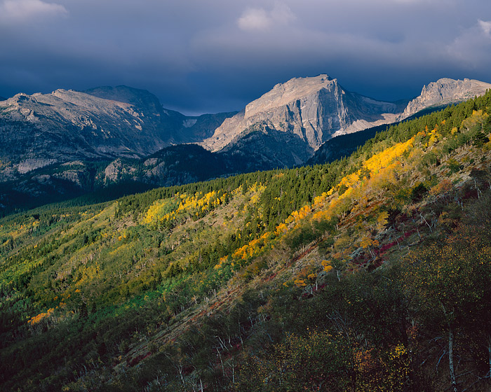 Ominous clouds greet the changing seasons. Hallet Peak and the Bierstadt Moraine are dapled in sun and shade on this beautiful...