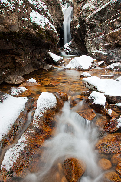 Snow falls on the granite that makes up beautiful Chasm Falls in Rocky Mountain National Park. While it's&nbsp;a cold day in...