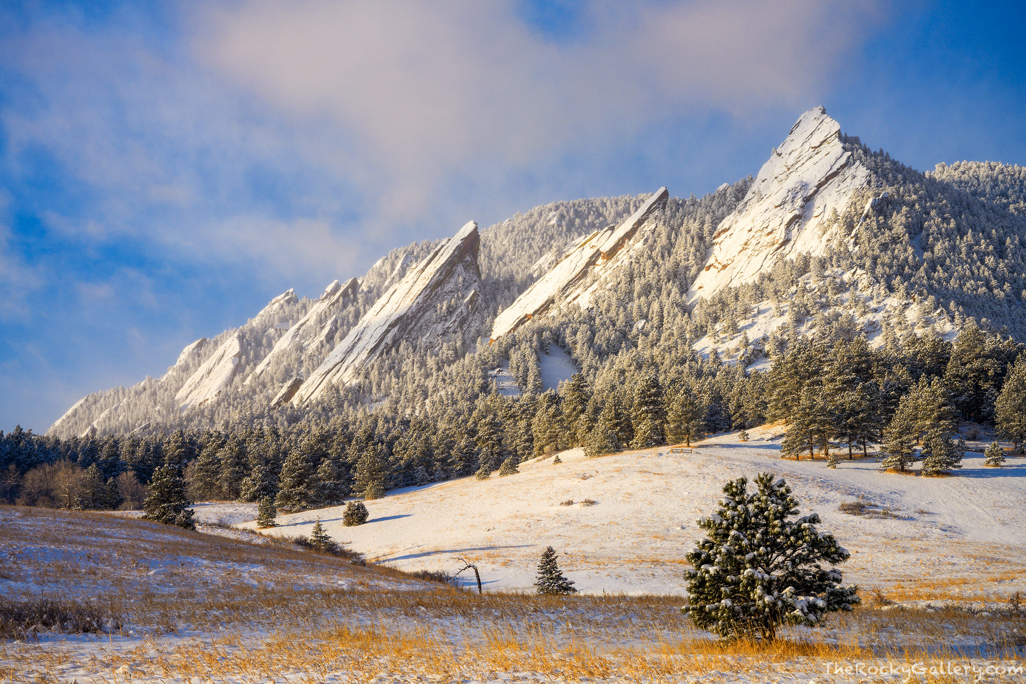 The Flatirons reveal themselves after a March storm has covered them along with Chautauqua Park and Meadow in fresh snow. The...