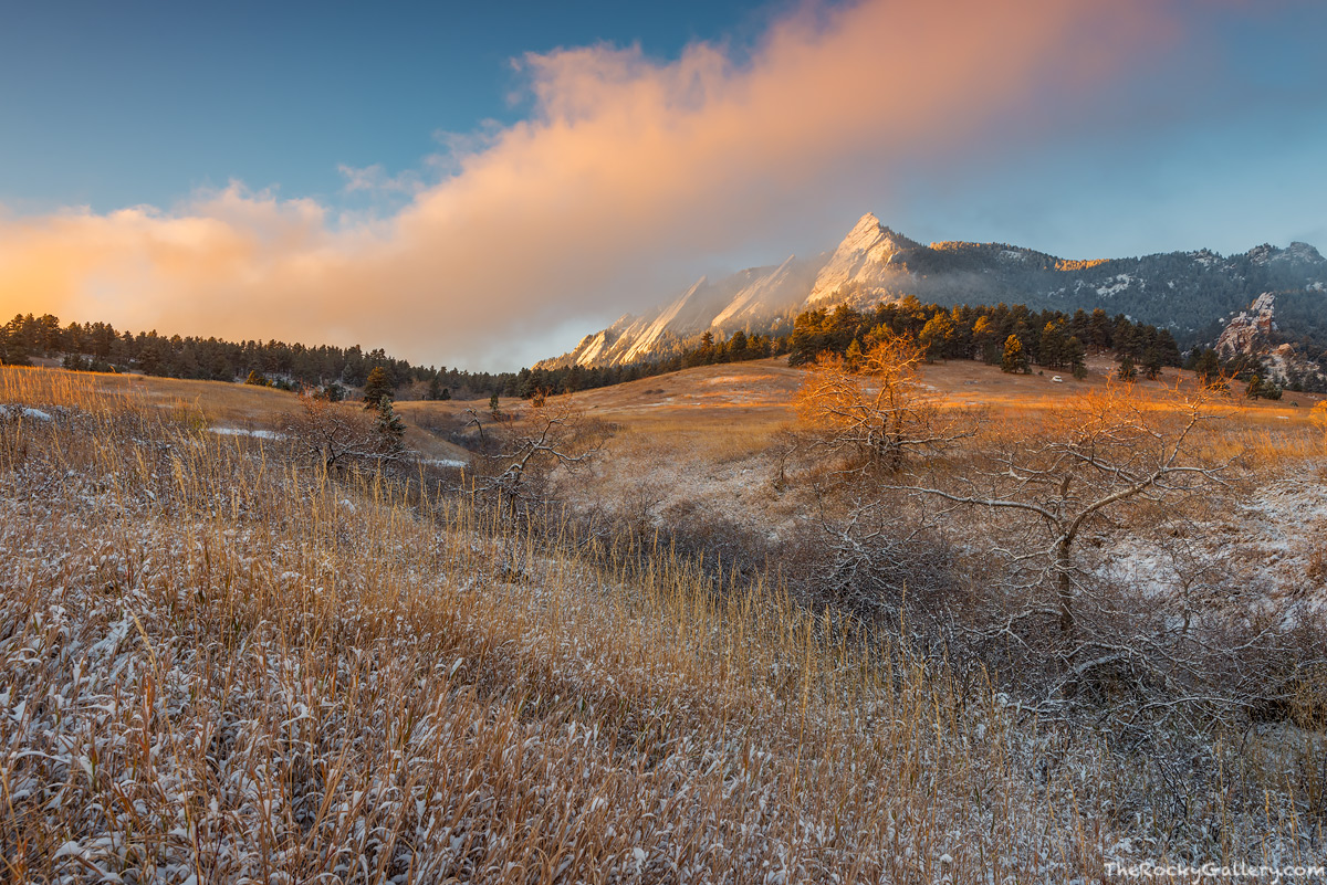 The clouds are quickly lifting above&nbsp;Chautauqua Park and The Flatirons after a light snow has coated the the mountains and...