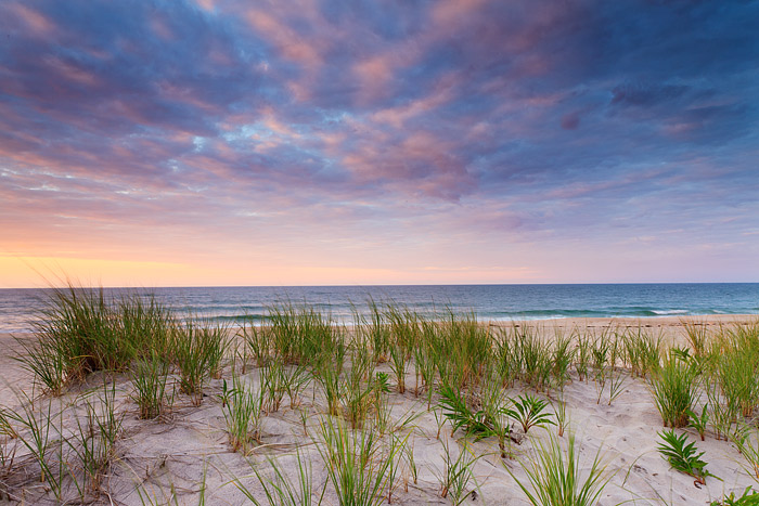 The skies above Coopers Beach put on quite a show at sunrise but the photographer is the only person on the beach this morning...