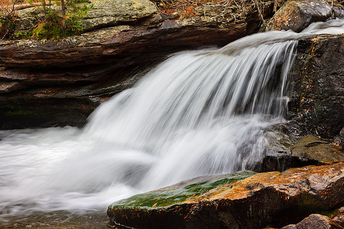 Copeland Falls and North Saint Vrain creek cascade over the rocks and boulders of this popular location in Wild Basin. Copeland...