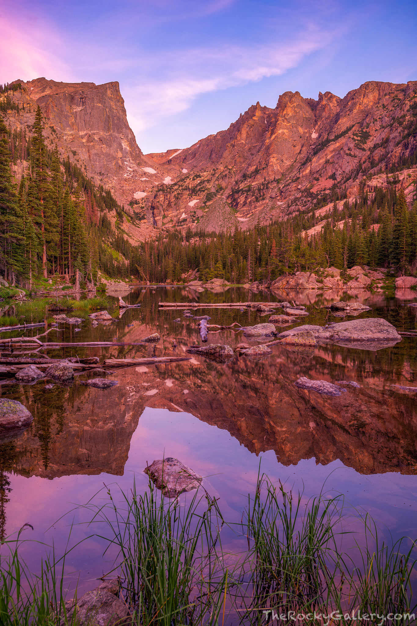 Pastels illuminate the landscape of Rocky Mountain National Park just before sunrise. Hallett Peak and Flattop Mountain reflect...