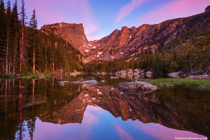 A spectacular pastel sky illuminates the sky over Hallett Peak, Flattop Mountain and Dream Lake as sunrise approaches. The still...