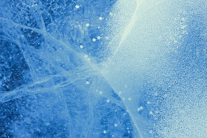 Air bubbles are frozen in time along the surface of Rocky Mountain National Park's Dream Lake. Frigid temperatures and Winter...