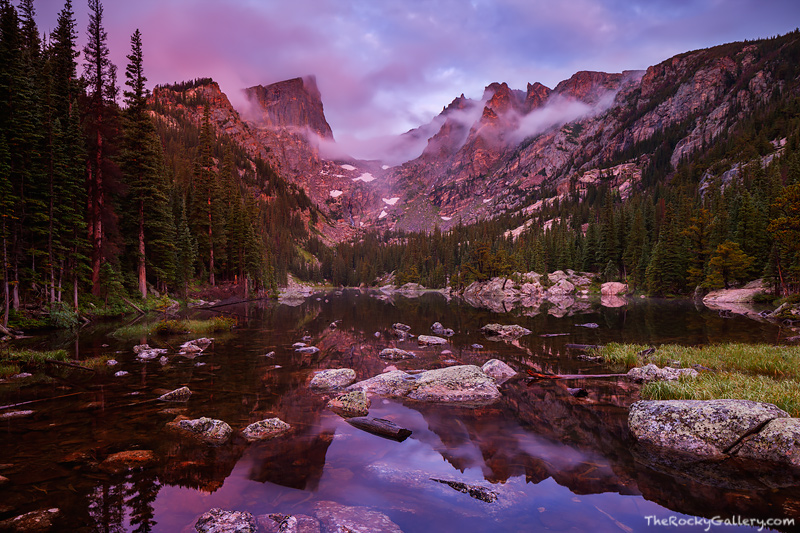 The very first hints of sunrise begin to reveal themselves at Dream Lake. A beautiful soft magenta hue coats Hallet and Flatop...