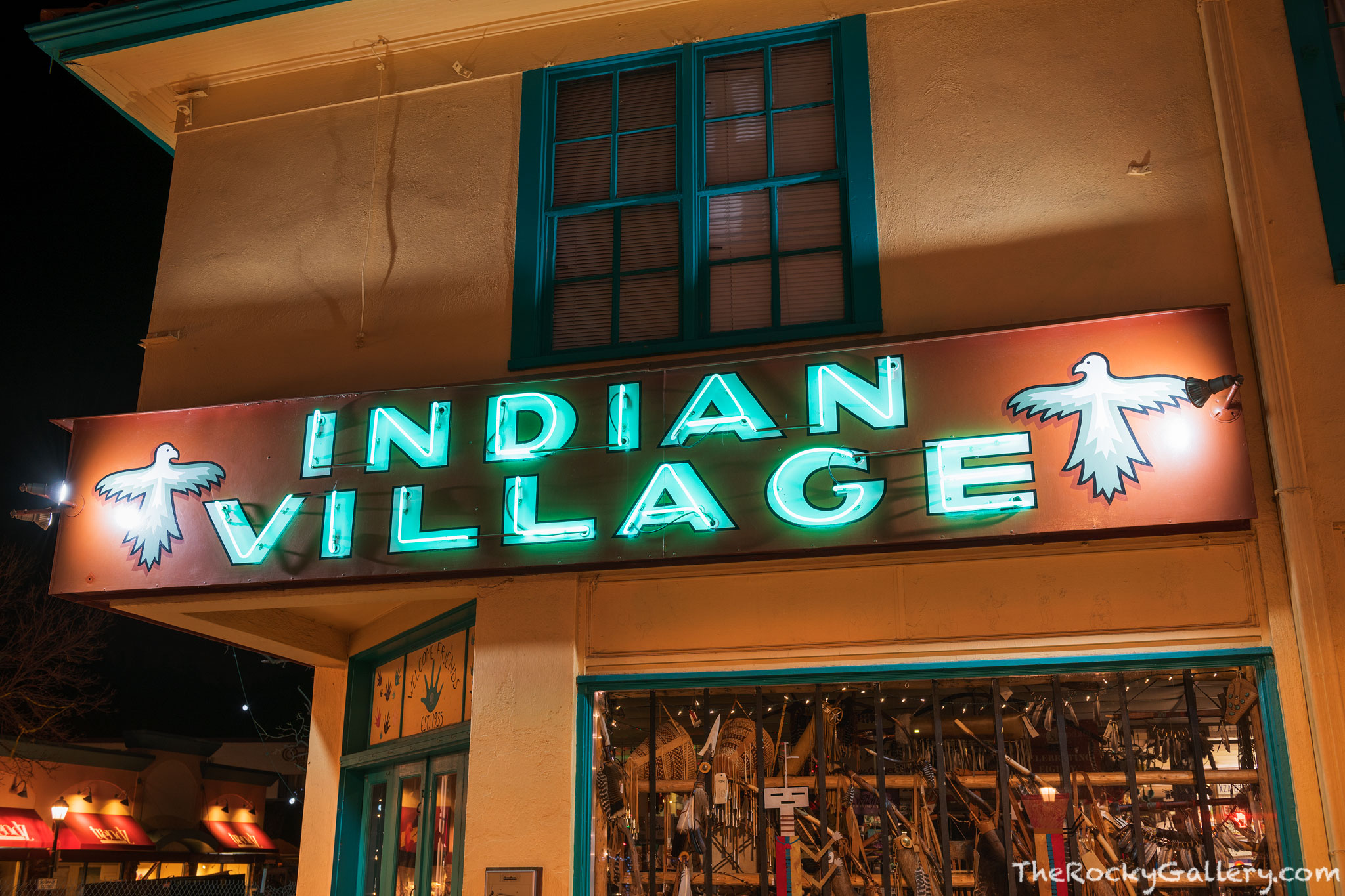 Millers Indian Village Store, an icon of Elkhorn Ave and Estes Park displays its signage on a cold and quiet January night in...