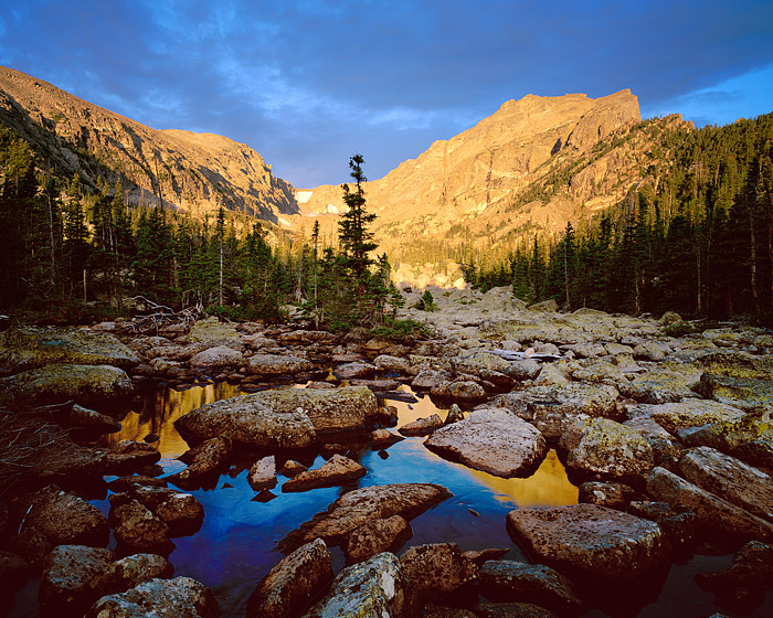 Hallet Peak reflects in Lake Haiyaha. Lake Haiyaha is a Native American term which means "many rocks". Visitors to this lake...