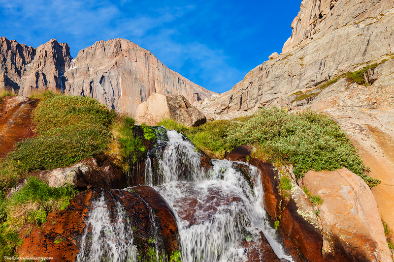 Rocky Mountain National Park's tallest peak hovers over Columbine Falls. 14,255 ft Longs Peak is Rocky Mountain National Park...