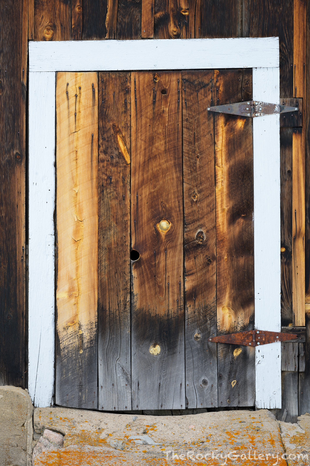 The west barn door at McGraw Ranch is a study in weathered wood and craftsmanship. This small barn door while crude also shows...