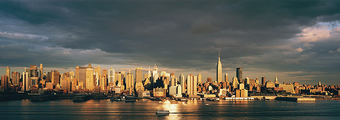 The clouds break at Sunset to bathe Midtown Manhattan and the Circle Line
