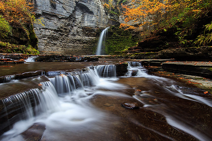 Eagle Cliff Falls plunges over the edge of the rocks and downstream into Havana Glen. Fall has settled into Havana Glen and Eagle...