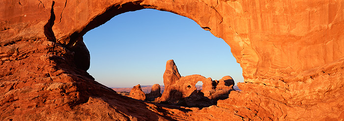 North Window Arch acts as a perfect natural frame for Turret Arch in this classic Utah View. Arches National Park is home to...