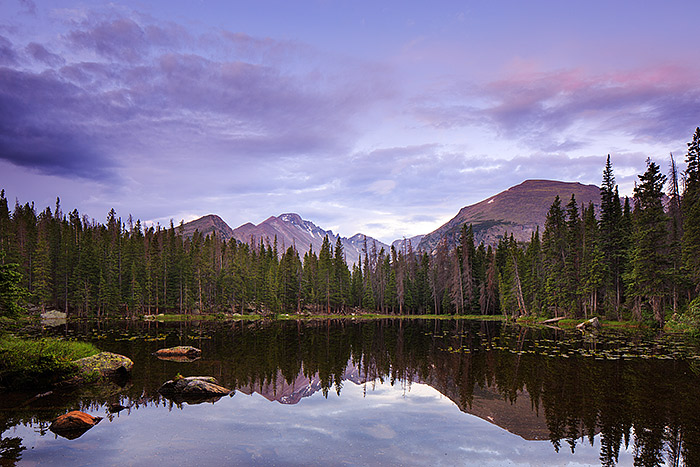 A total stillness envelopes Nymph Lake and Longs Peak on a tranquil morning in Rocky Mountain National Park. There is no wind...