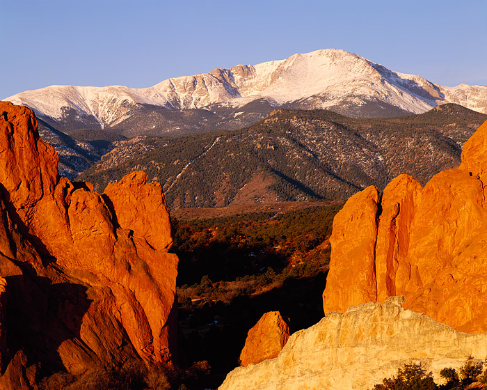 Pikes Peak is scene through Gateway rock at Garden of the Gods just west of downtown Colorado Springs. Pikes Peak is one of Colorado...