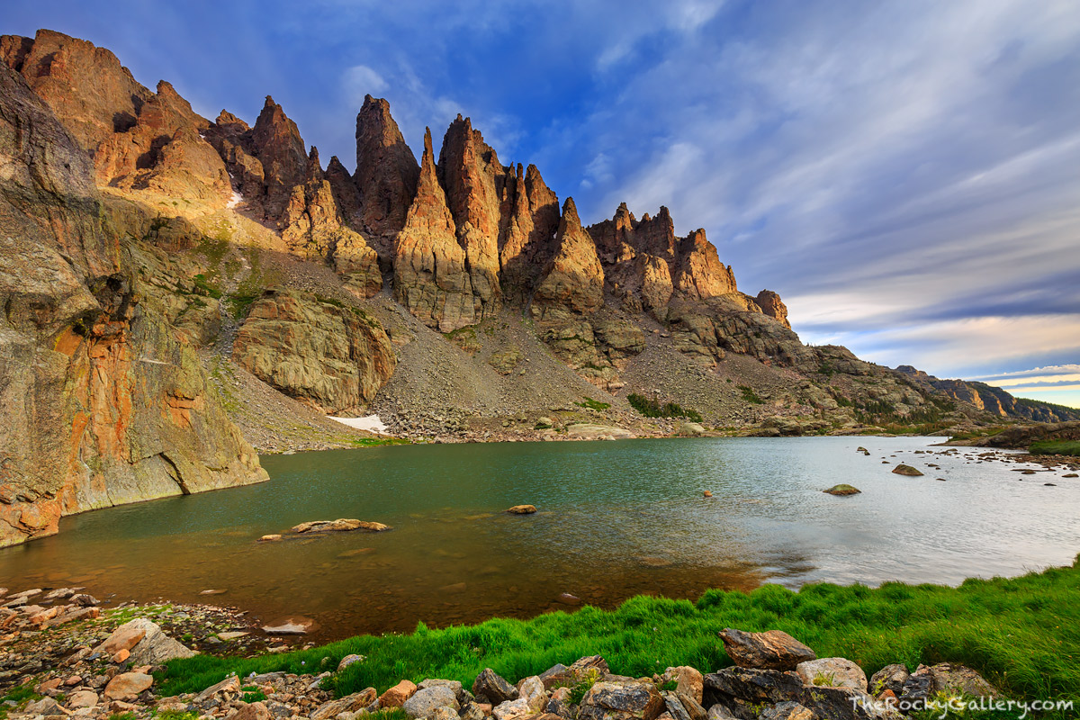 A ray of sun pierces the cloud cover and illuminates the famous granite formations above Sky Pond. Without question Sky Pond...