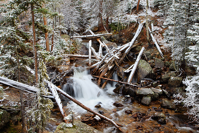 North Saint Vrain creek tumbles through downed trees in the Wild Basin area of Rocky Mountain National Park. The North Saint...