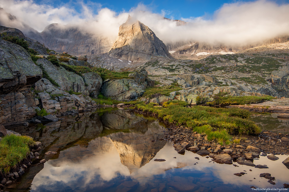 As the sun rises over Rocky Mountain National Park, clouds and fog begin to lift their veil from the mountaintops. The Spearhead...