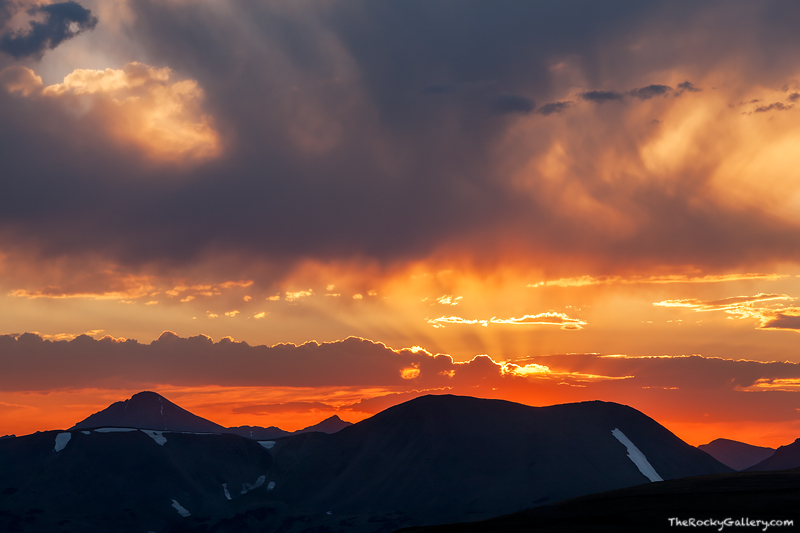 A spectacular sunset unfolds over Trail Ridge Road and the high country of Rocky Mountain National Park. The sun has just set...