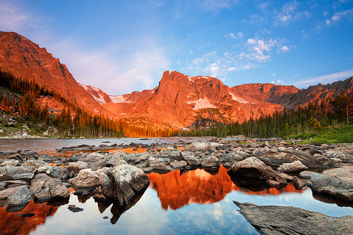 Notchtop Mountain and Flattop Mountain put on their own fireworks display on this beautiful fourth of July morning. Smoke from...