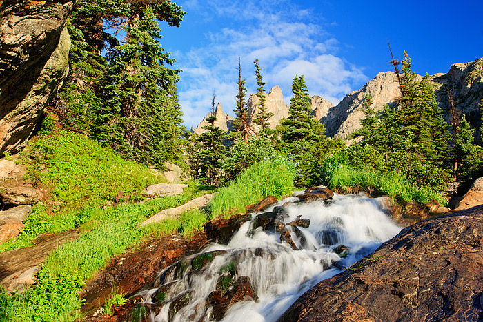 Tydall Falls cascades through the pines between Emerald Lake&nbsp;and Dream Lake in Rocky Mountain National Park. Mountain Blue...