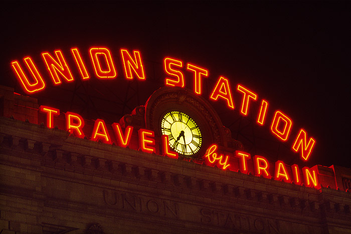 The famous neon sign that sits atop Denver's Union Station shines brightly over Denver's lower downtown area. Union Station is...