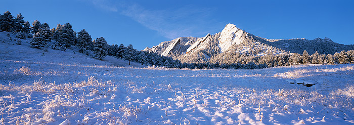 Snow and clear, crisp blue skies greet the famous Flatirons of Boulder, Colorado. This view of the Flatirons was photographed...