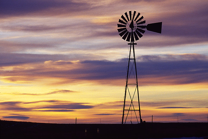 A Windmill and Cistern are viewed on the high plains of Wyoming near Bill. In this portion of Wyoming, Cattle and Antelope outnumber...