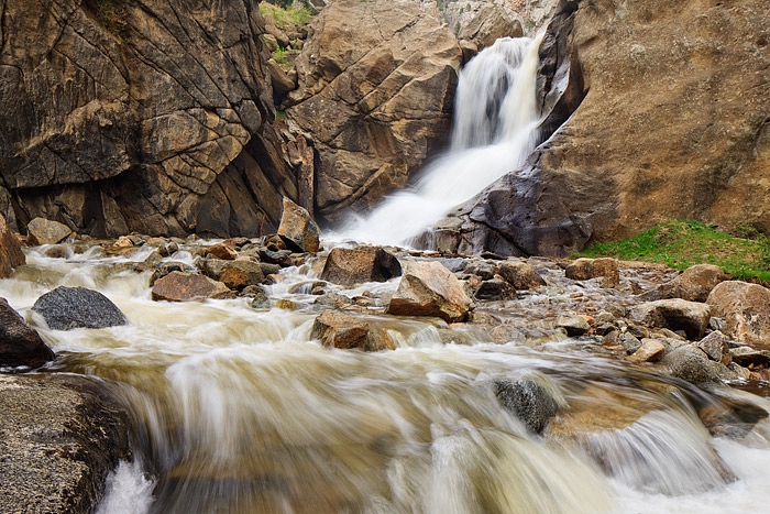 North Boulder Creek pours over Boulder Falls fresh with runoff from melting snow above. North Boulder Creek has to navigate not...